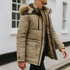 Hooded winter jacket with faux fur trim and zip front, lined for warmth and outdoor comfort