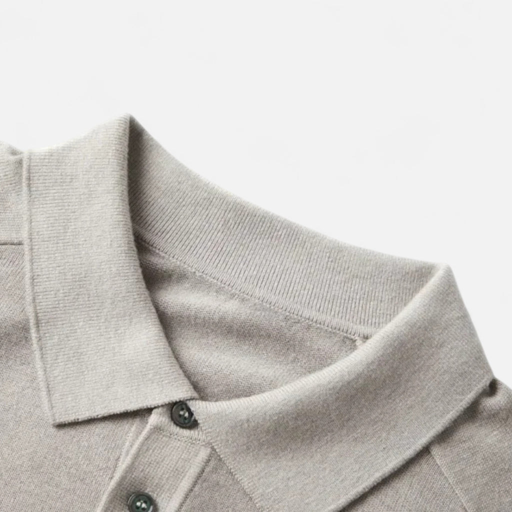 Knit polo sweater with button placket and classic collar, styled for a refined casual look
