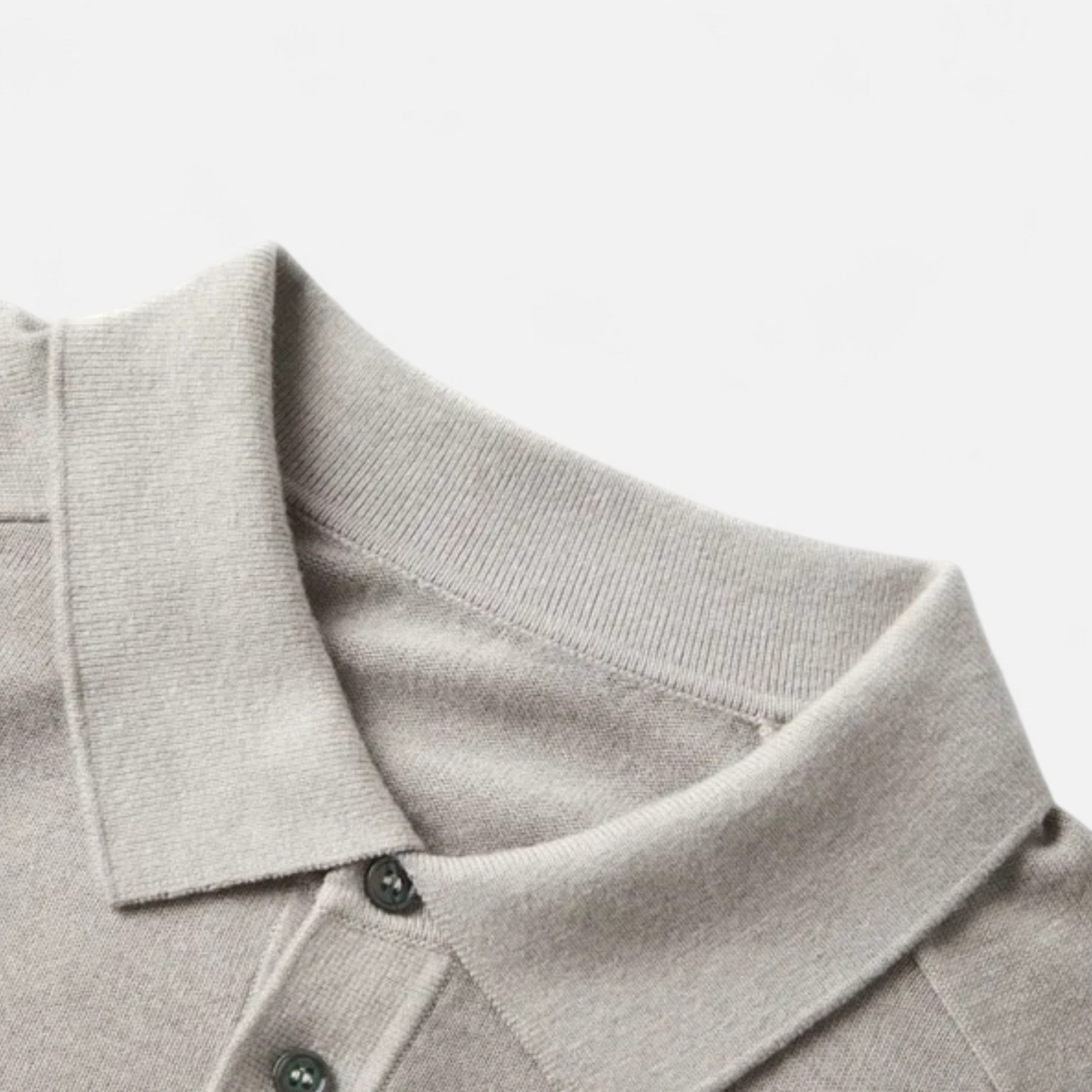 Knit polo sweater with button placket and classic collar, styled for a refined casual look