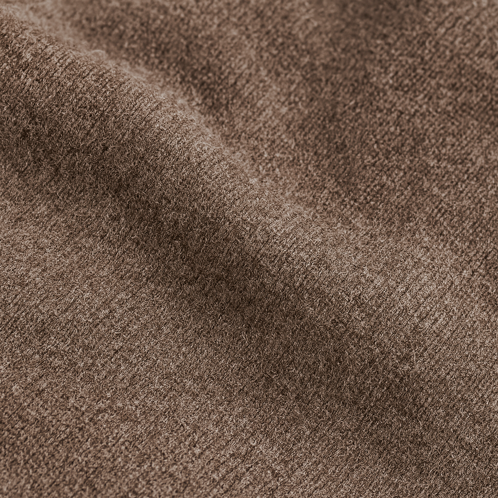 Crew neck knit sweater with fine texture and ribbed hems, styled for a smart casual look